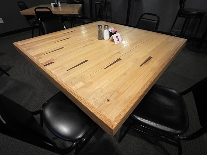 Tabletops are repurposed Bowling Alley Lanes