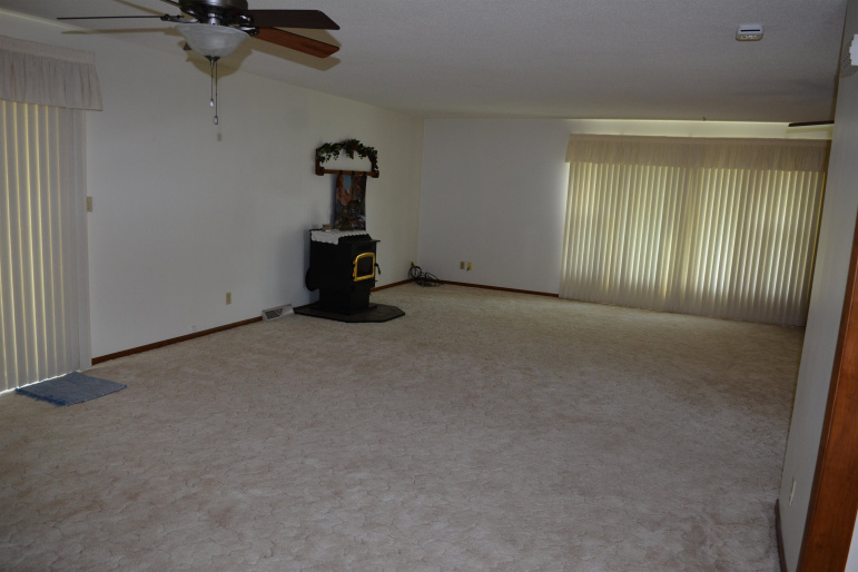 sliding glass doors will lead you the covered patio